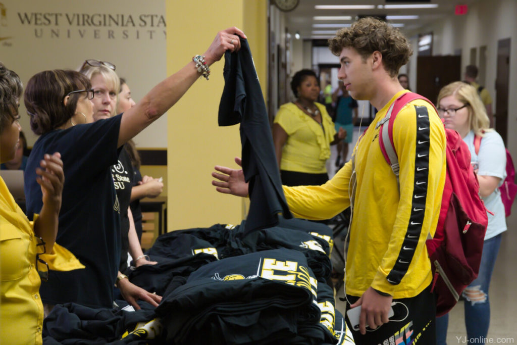 New students receive State Stride t-shirts. (Jon Musselwhite/YJ Online)