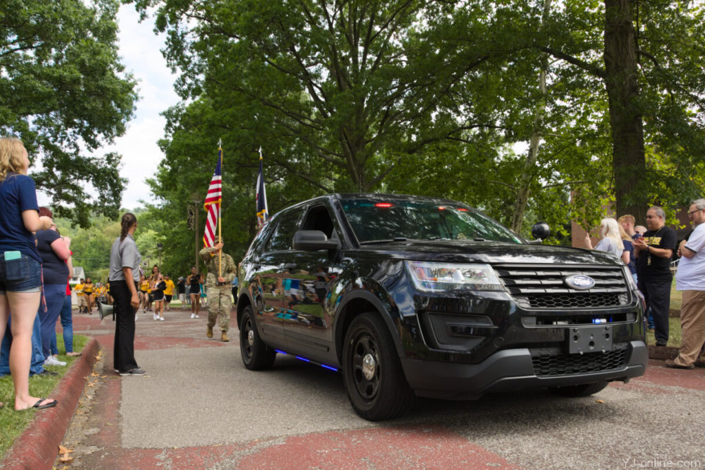 The State Stride procession begins with campus security displaying their lights and siren. (Jon Musselwhite/YJ Online)