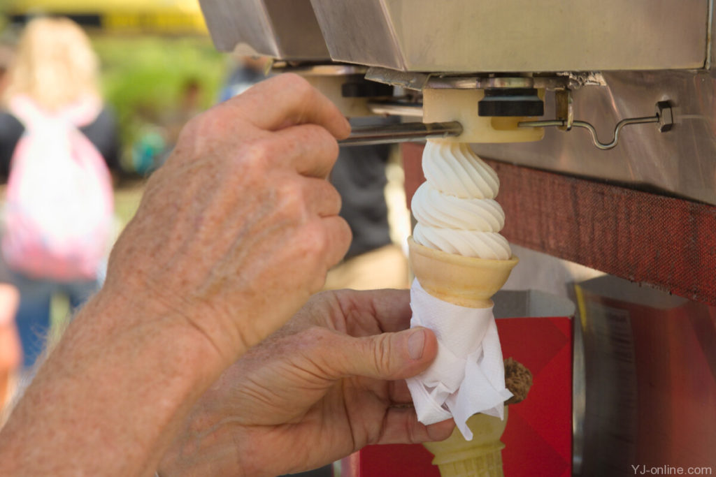 A soft-serve ice cream helps temper the soaring heat on State Stride day. (Jon Musselwhite/YJ Online)