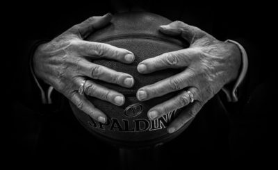 Hands holding a basketball